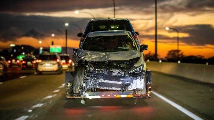 Damaged car being towed