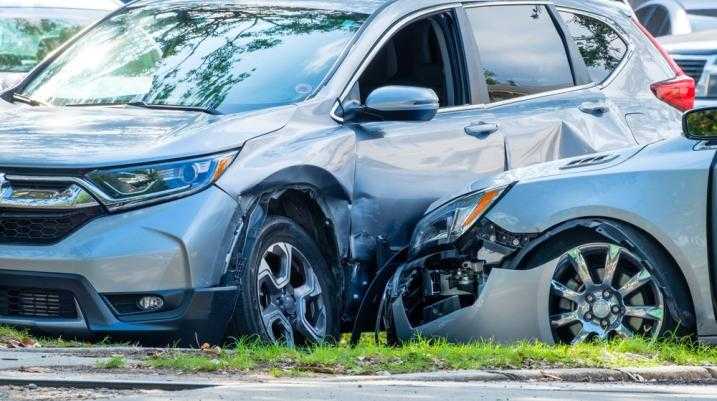 Two cars crashed into each other in a parking lot