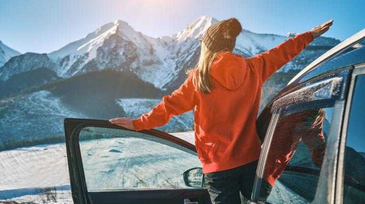 girl driving car in the winter