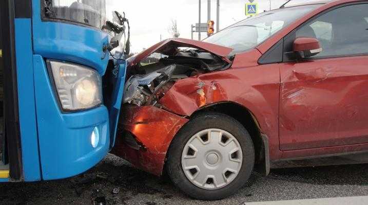 Red car crashed into blue bus