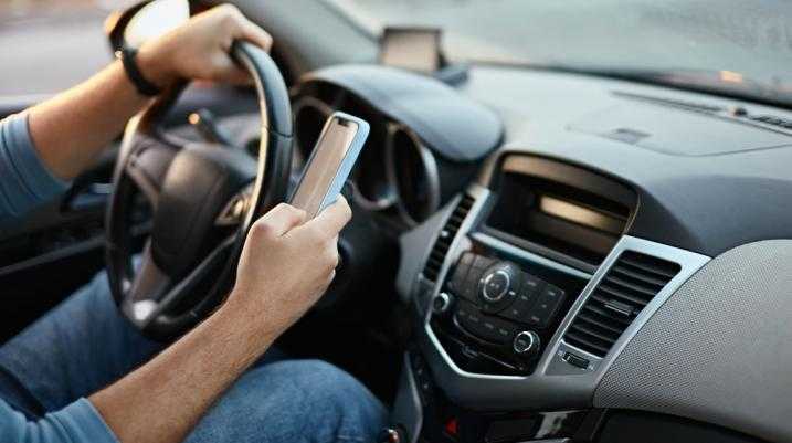 Man texting while driving