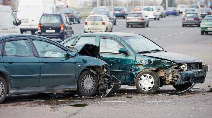 Two green cars crashed into each other