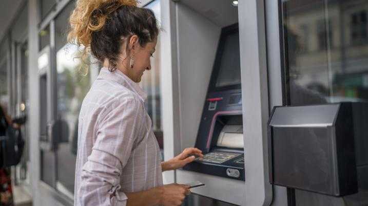 Women using an ATM