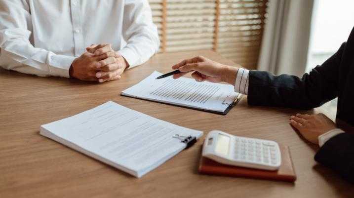 Lawyer and client discussing paperwork