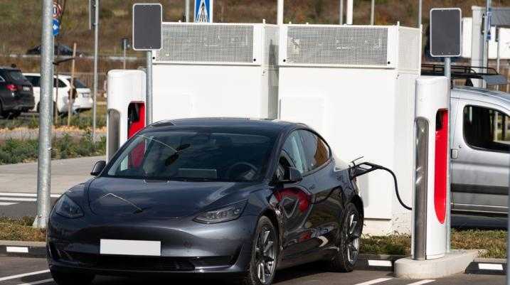 Tesla at a charging station