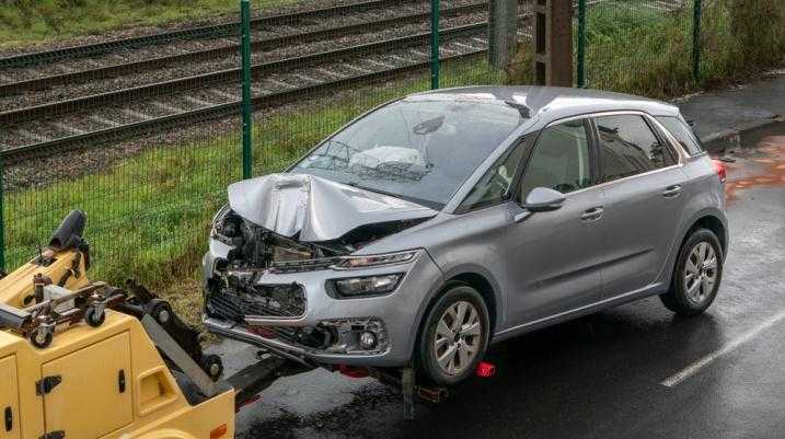 Damaged car being towed