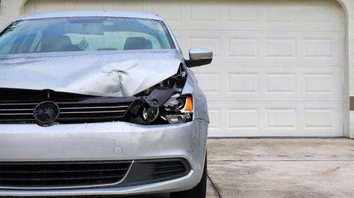 Damaged car in a driveway