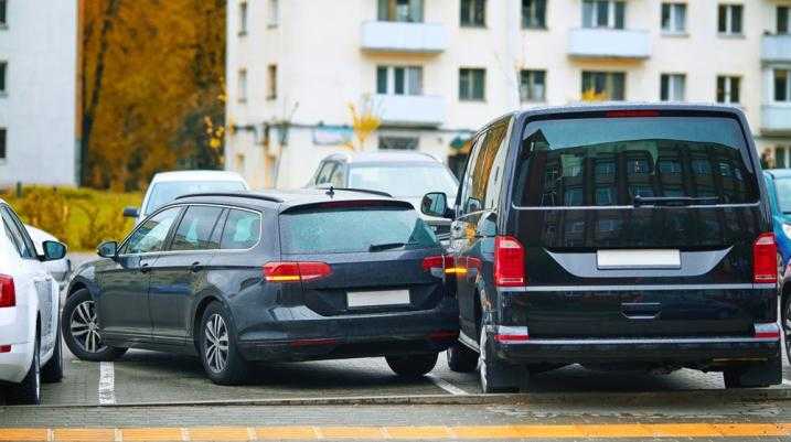 Car parked sideways in a lot