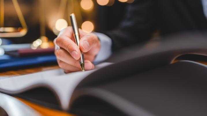 Businessman writing with a pen