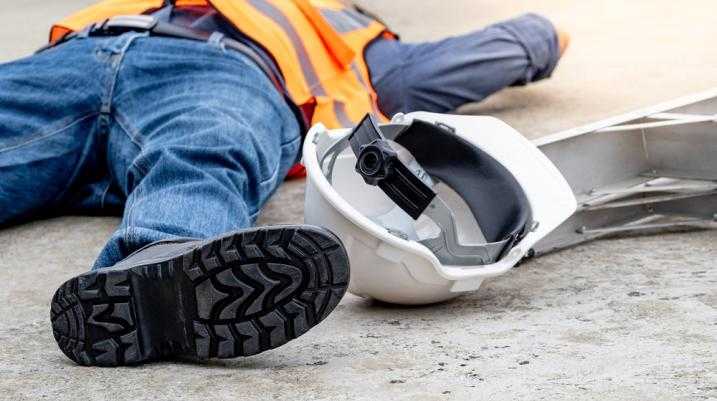 Construction worker laying on the floor