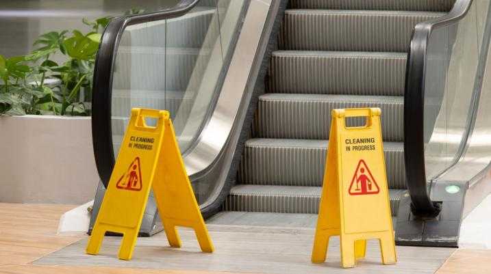 slip and fall sign at escalators