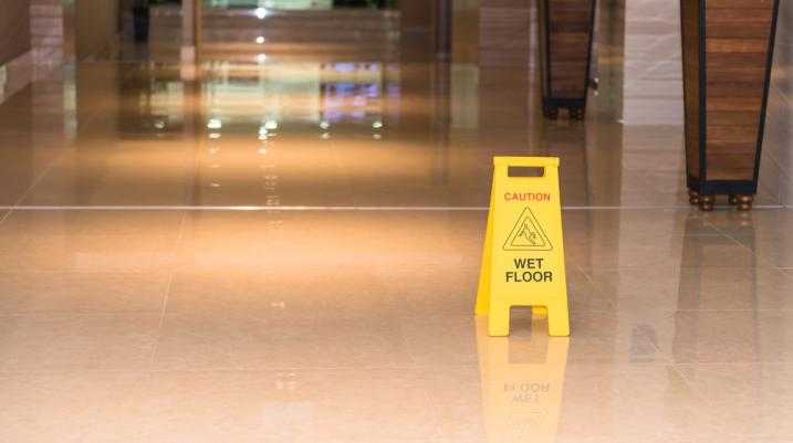 Caution wet floor sign in a hallway