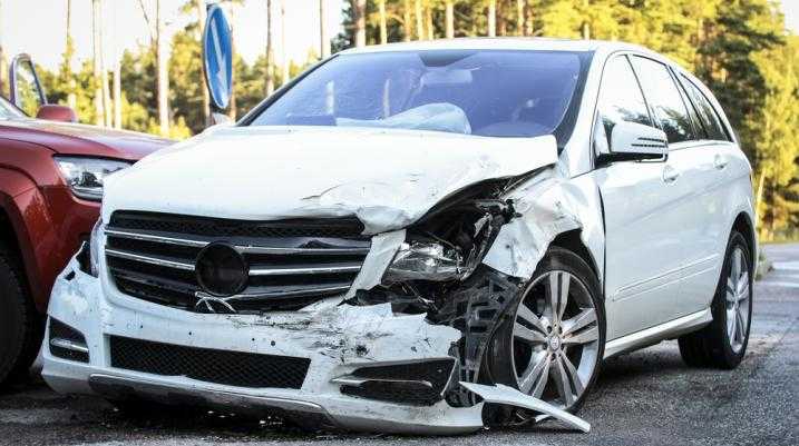 Damaged white car on the street