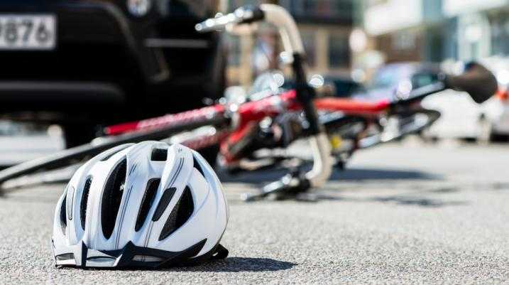 Bike helmet and bike fallen down on the road 