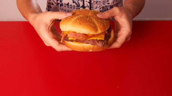 Woman holding a burger