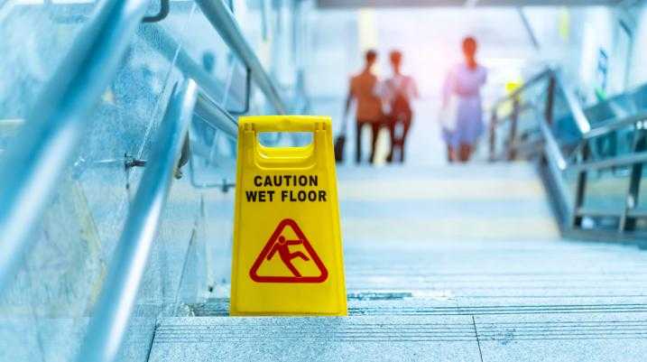 slippery floor sign on the stairs