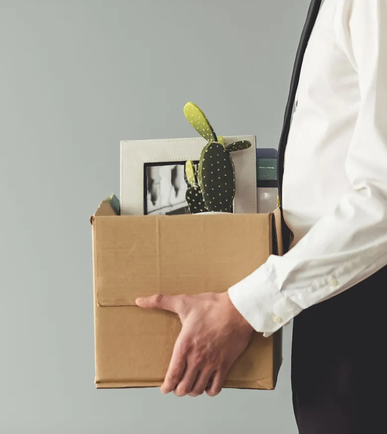 Man with office supplies in box