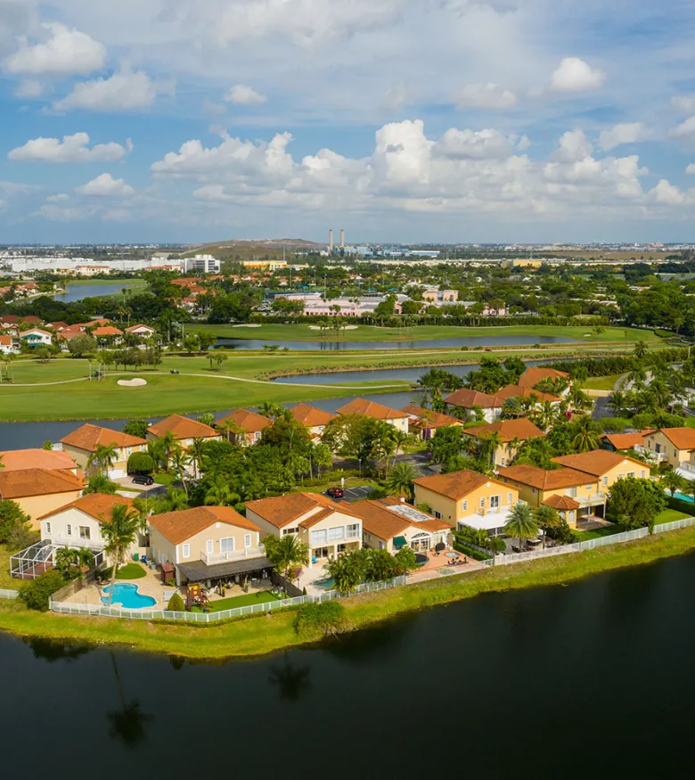 Aerial view of a lush Pembroke Pines neighborhood, showcasing community safety ensured by local personal injury lawyers.