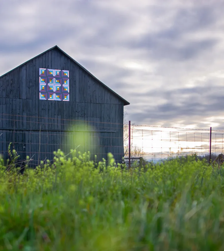 Rustic barn in Richmond amidst green fields, embodying the peace and protection offered by local personal injury lawyers.