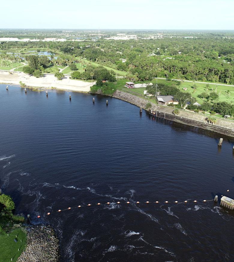 Aerial view of a river winding through Port St. Lucie, highlighting the community supported by personal injury lawyers.