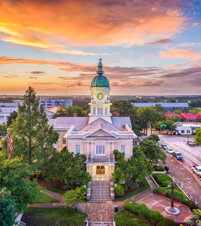 Athens cityscape featuring the iconic courthouse at sunset, symbolizing justice and local personal injury lawyers' support.