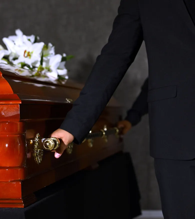 Men in suits holding casket