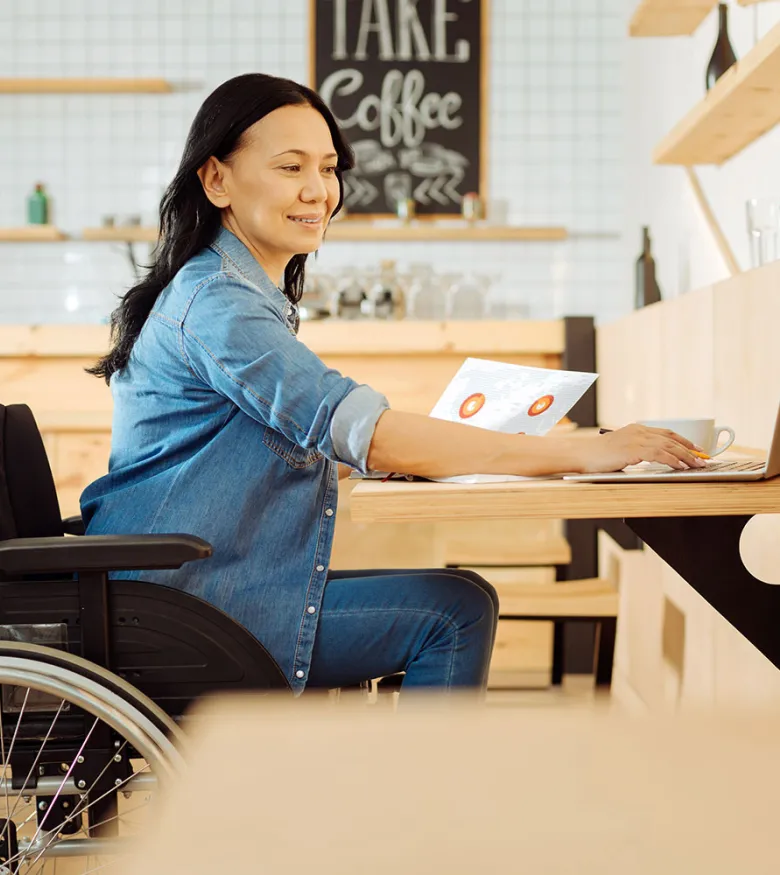 Social Security Lawyers in Macon, GA - Woman in wheelchair on computer