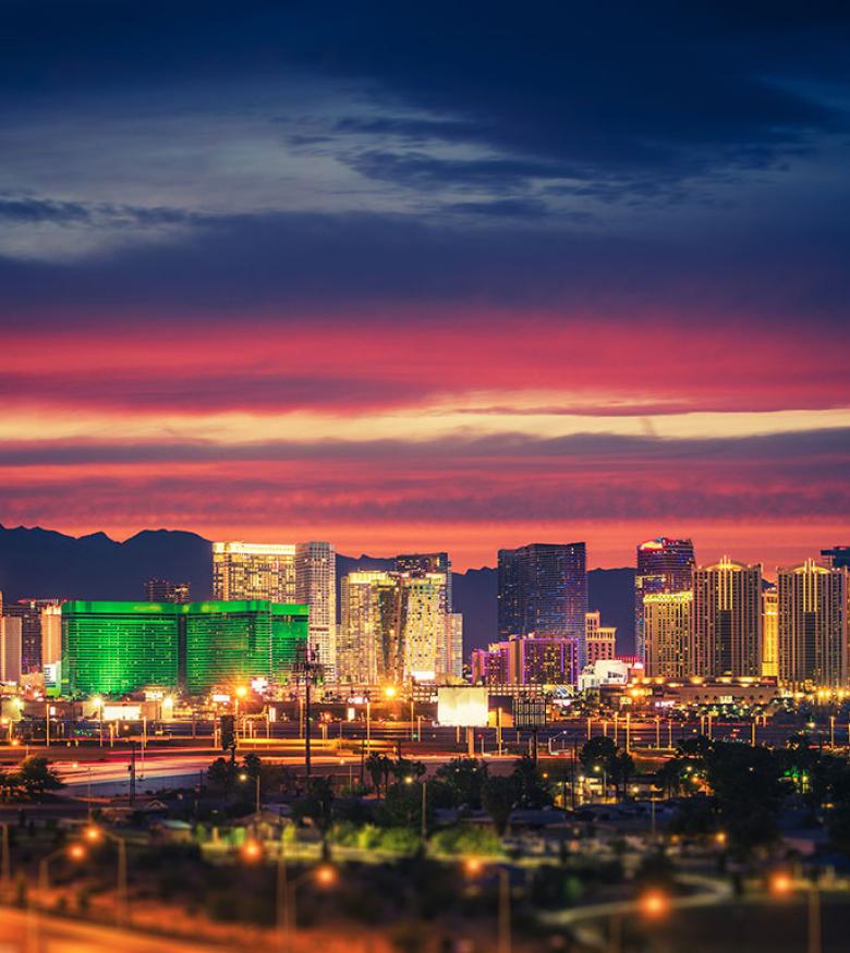Vibrant Las Vegas skyline at dusk with radiant clouds, a bustling city for personal injury lawyers.