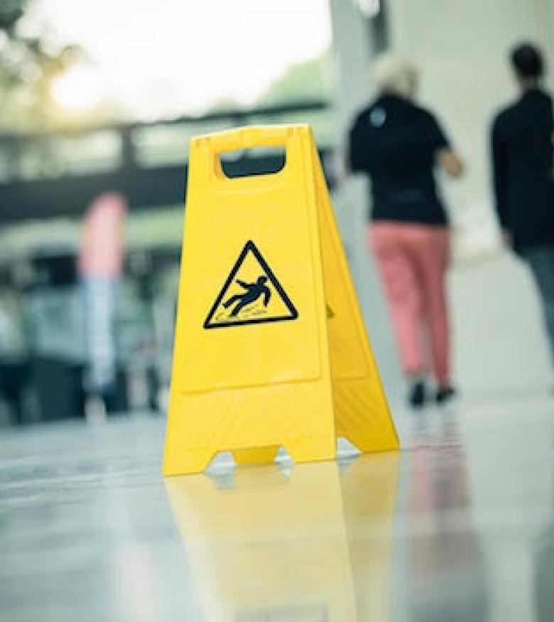 Best Injury Lawyers in Durham - slip and fall sign