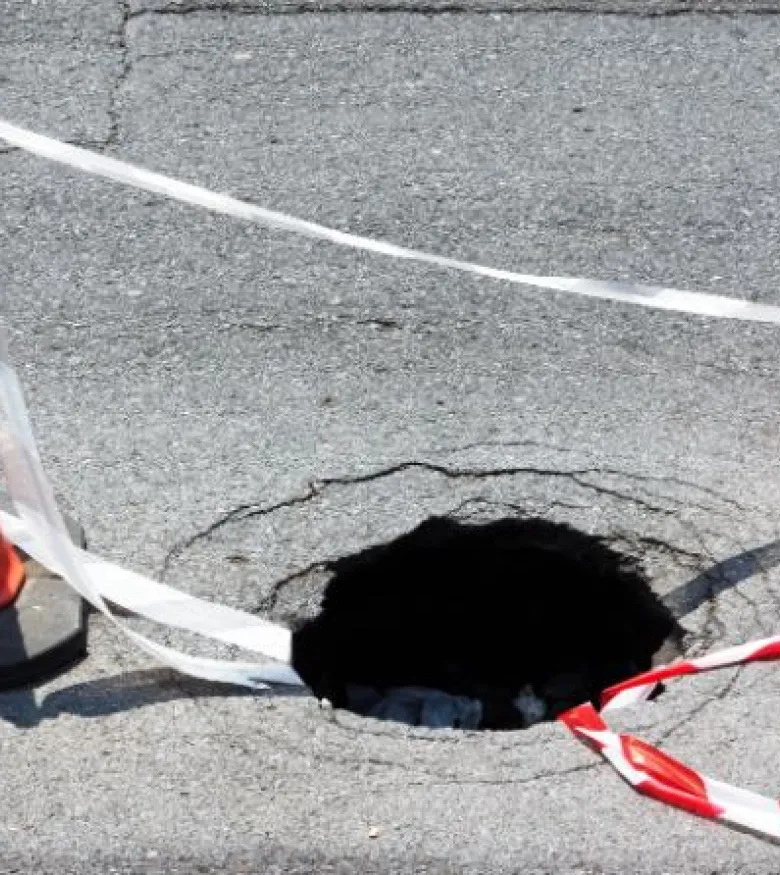 Sinkhole Attorneys in Tampa, FL - sinkhole in the street