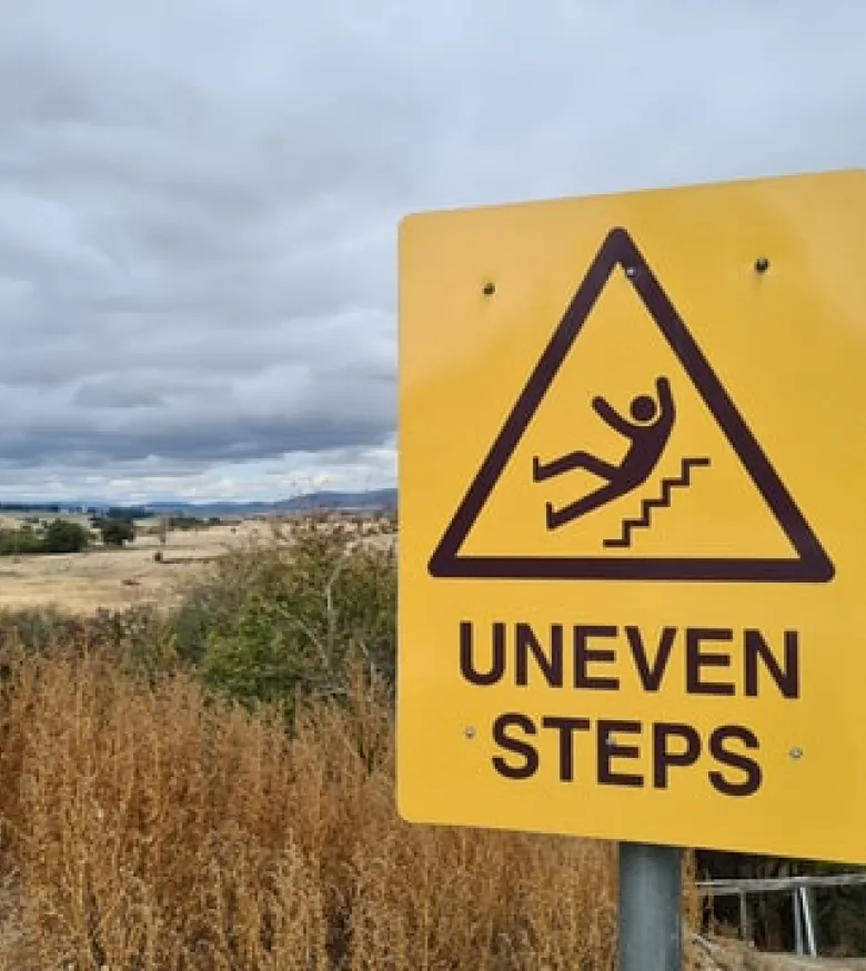 What Should I Do After a Slip and Fall in Indianapolis - uneven steps sign