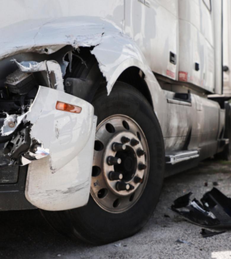 An accident involving a truck and a damaged car, highlighting the need for a Truck Accident Attorney in Fargo.
