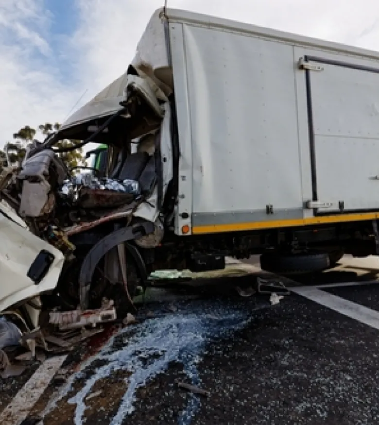 Wrecked truck on highway, need for a truck accident attorney in Albuquerque.