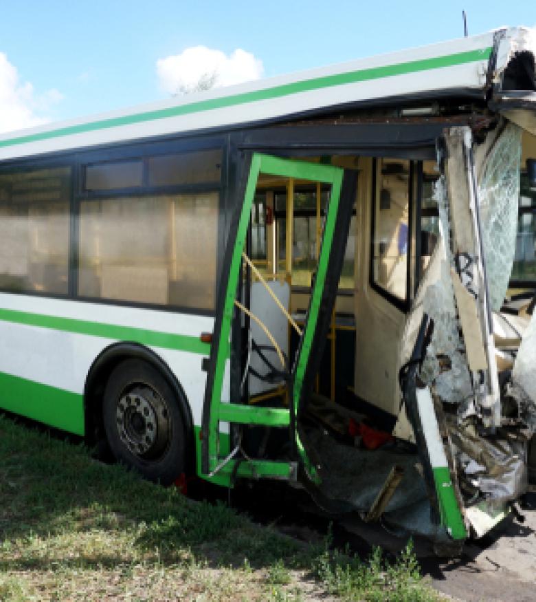 Severely damaged bus after an accident, contact a bus accident attorney in The Bronx for legal aid.