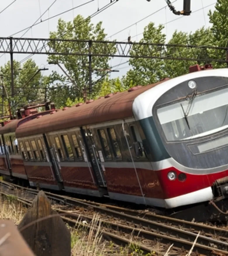 Image of a train accident for a Truck Accident Attorney in The Bronx, showing a derailed train on the tracks with trees in the background.