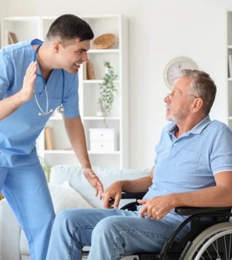 A caregiver aggressively confronting an elderly man in a wheelchair, emphasizing the need for a Nursing Home Abuse Lawyer in New Albany to provide legal assistance.