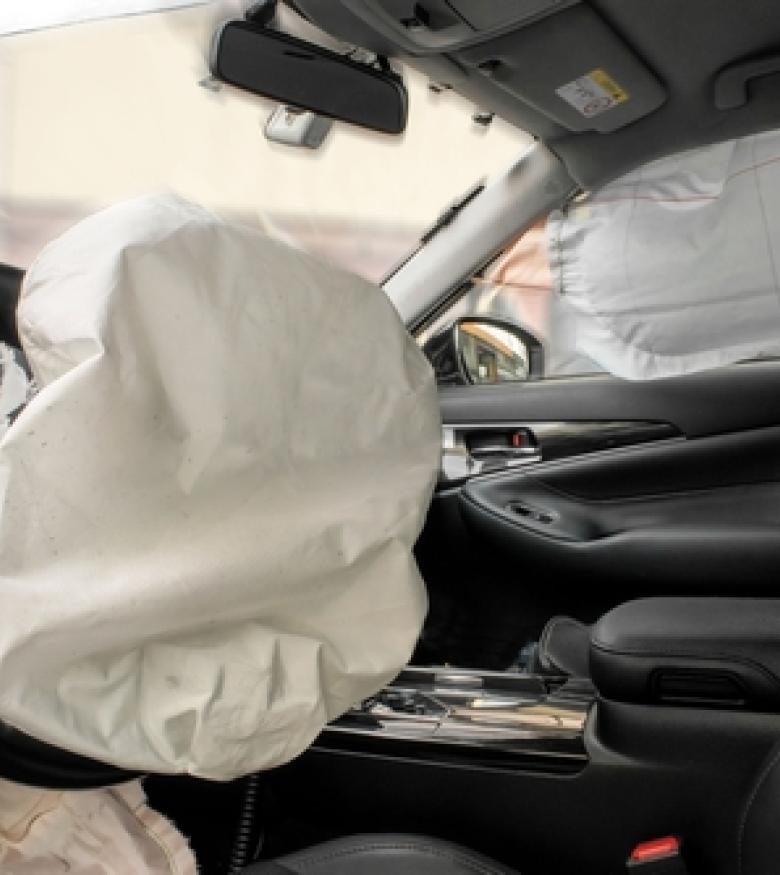 Interior of a car with deployed airbags after a crash, emphasizing the need for an attorney specializing in Airbag Injuries in Melbourne.