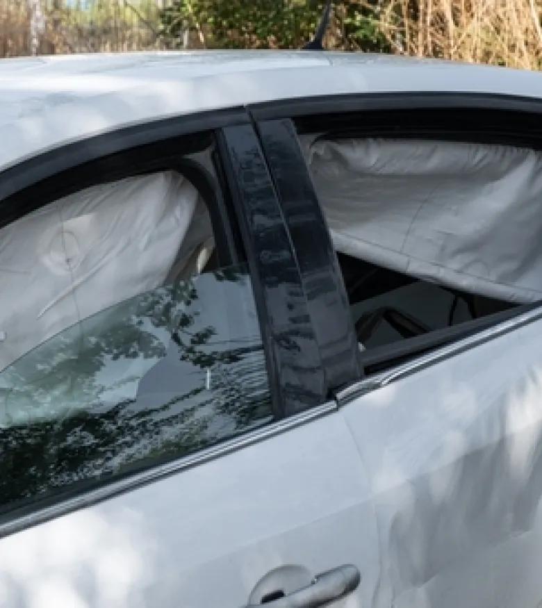 A car with deployed airbags after an accident, highlighting the need for legal help for Airbag Injuries in Kissimmee.