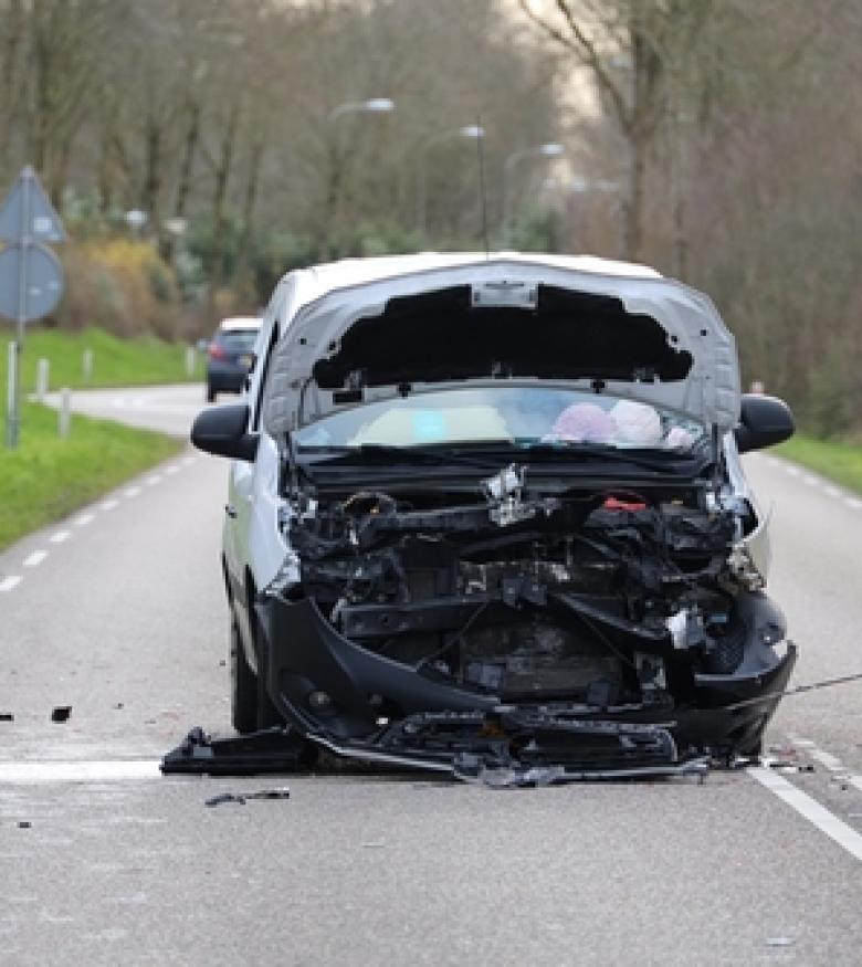 Front-end collision on a road, emphasizing the need for a car wreck lawyer in Charleston, WV.