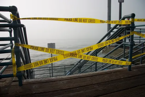 Speed Boat Operator in Fatal Crash Charged With 13 Felonies - Police Tape at Dock