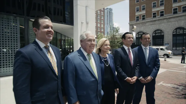 Image of the Morgan Family outside the Morgan & Morgan Orlando office