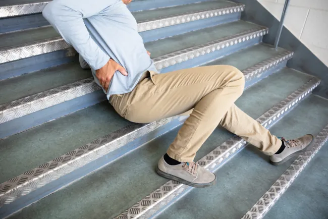 man falling down stairs