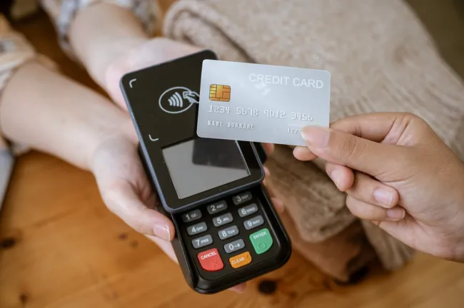 Client swiping their credit card at a store