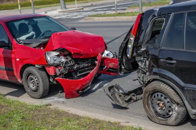 Red car rear ended into a black car