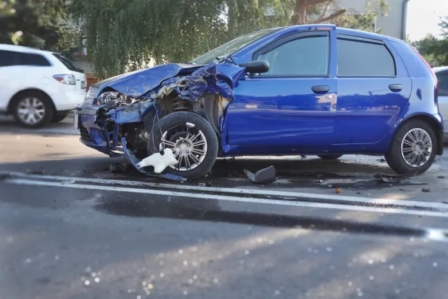 Blue car damaged after an accident