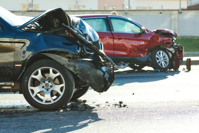 Two damaged cars after an accident on the street