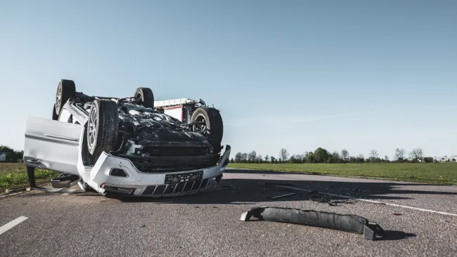 Truck flipped upside down on the road