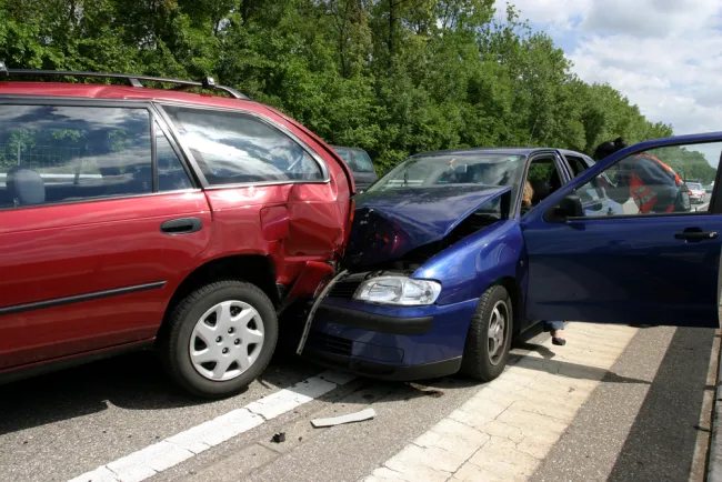 Blue car crashed into a red van