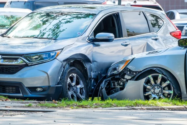 Two cars crashed into each other in a parking lot