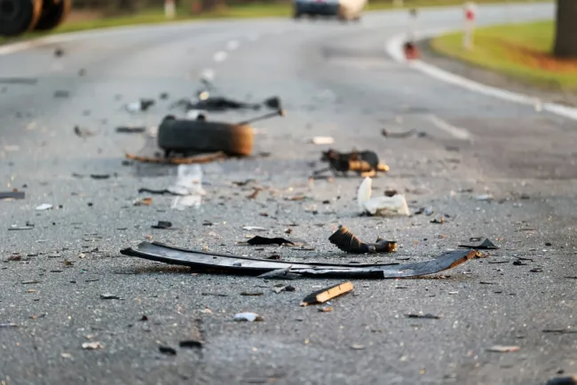 Debris from a car accident on a road